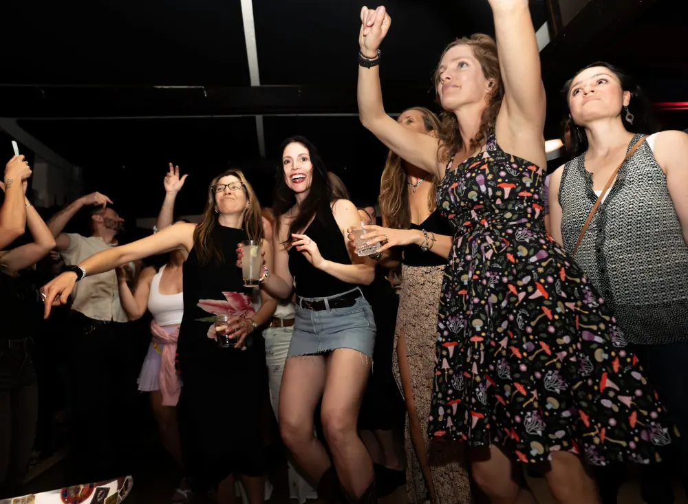 Fans dancing and cheering at a Midlife on Mars performance